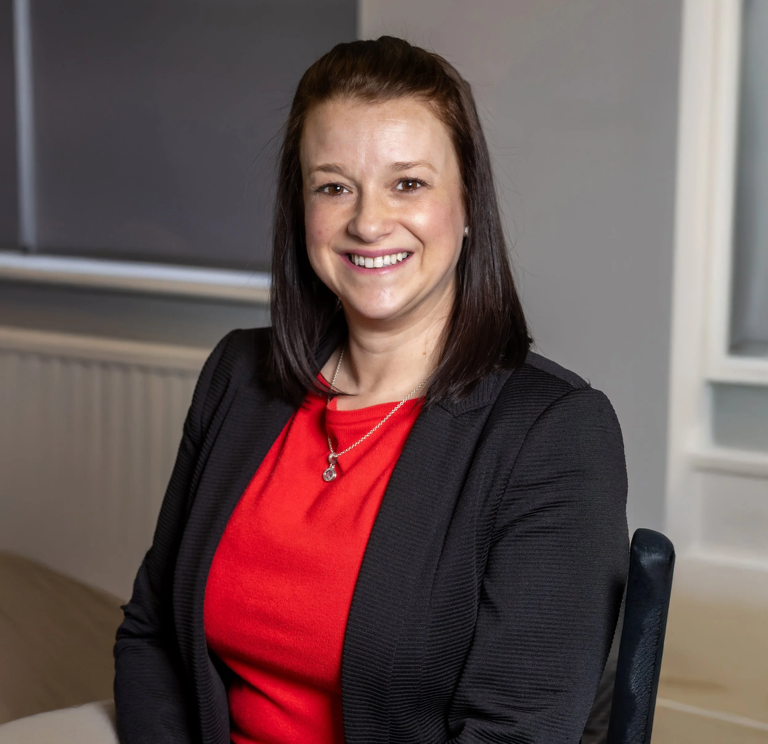 A professional headshot of SyPro Director, Laura Wakeman