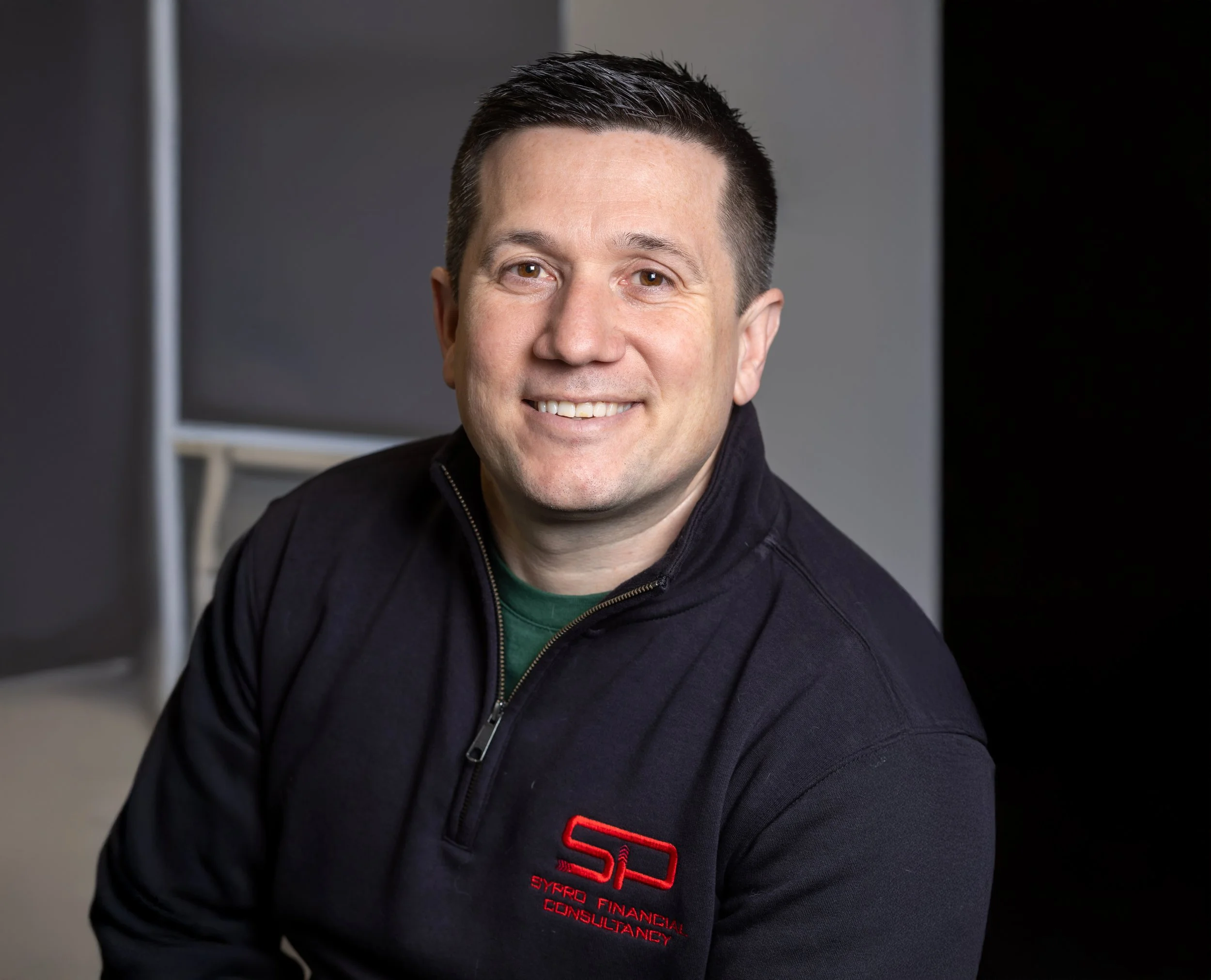 A professional headshot of SyPro Managing Director, Ryan Wakeman
